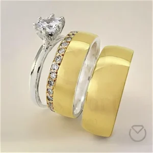 Argollas de matrimonio y anillo de compromiso con diamante central