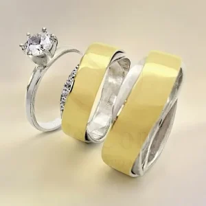 Argollas de matrimonio y anillo de compromiso con diseño moderno